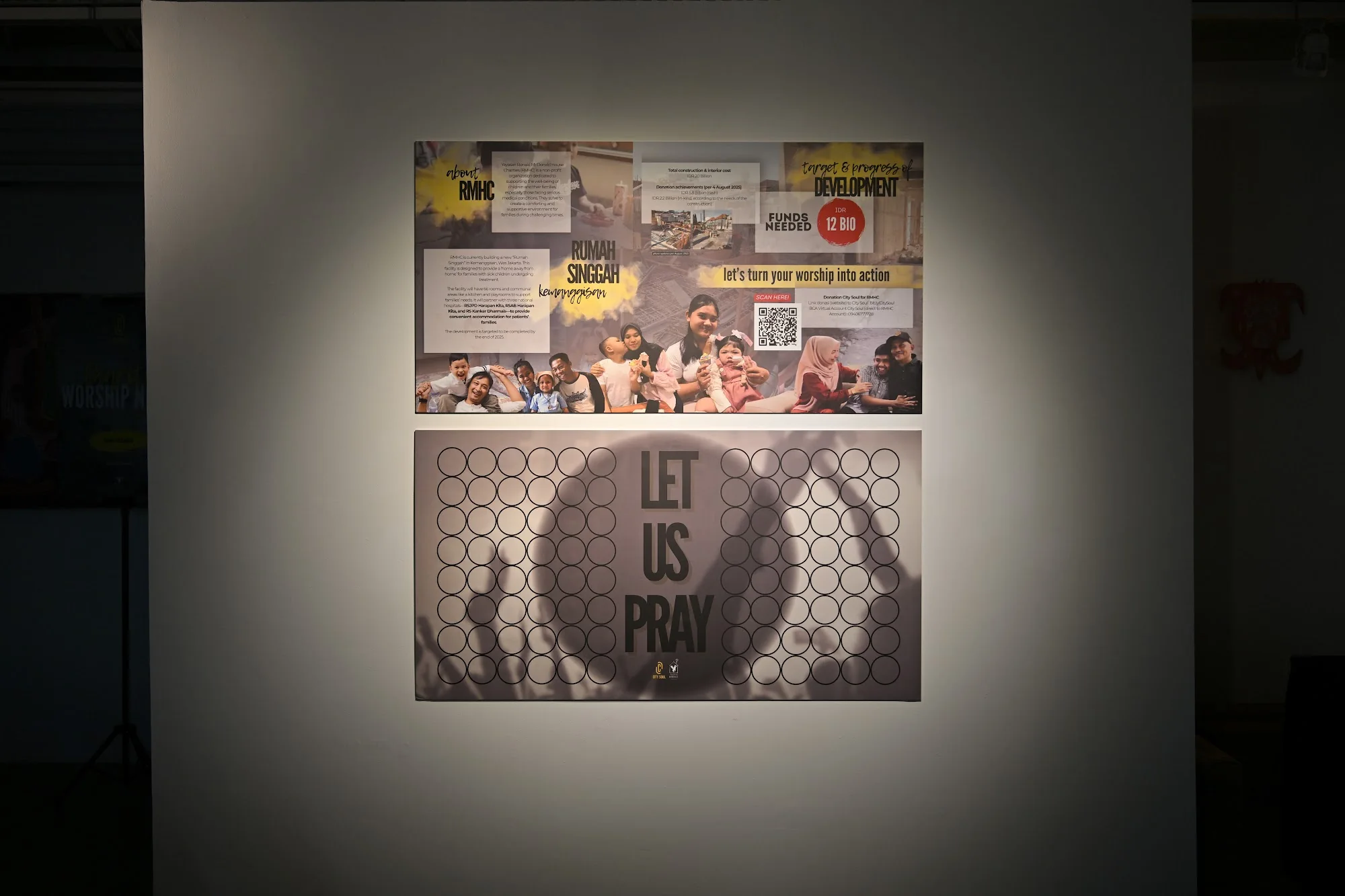 A prayer wall with handwritten notes and a Let Us Pray display at City Soul Vol. 1