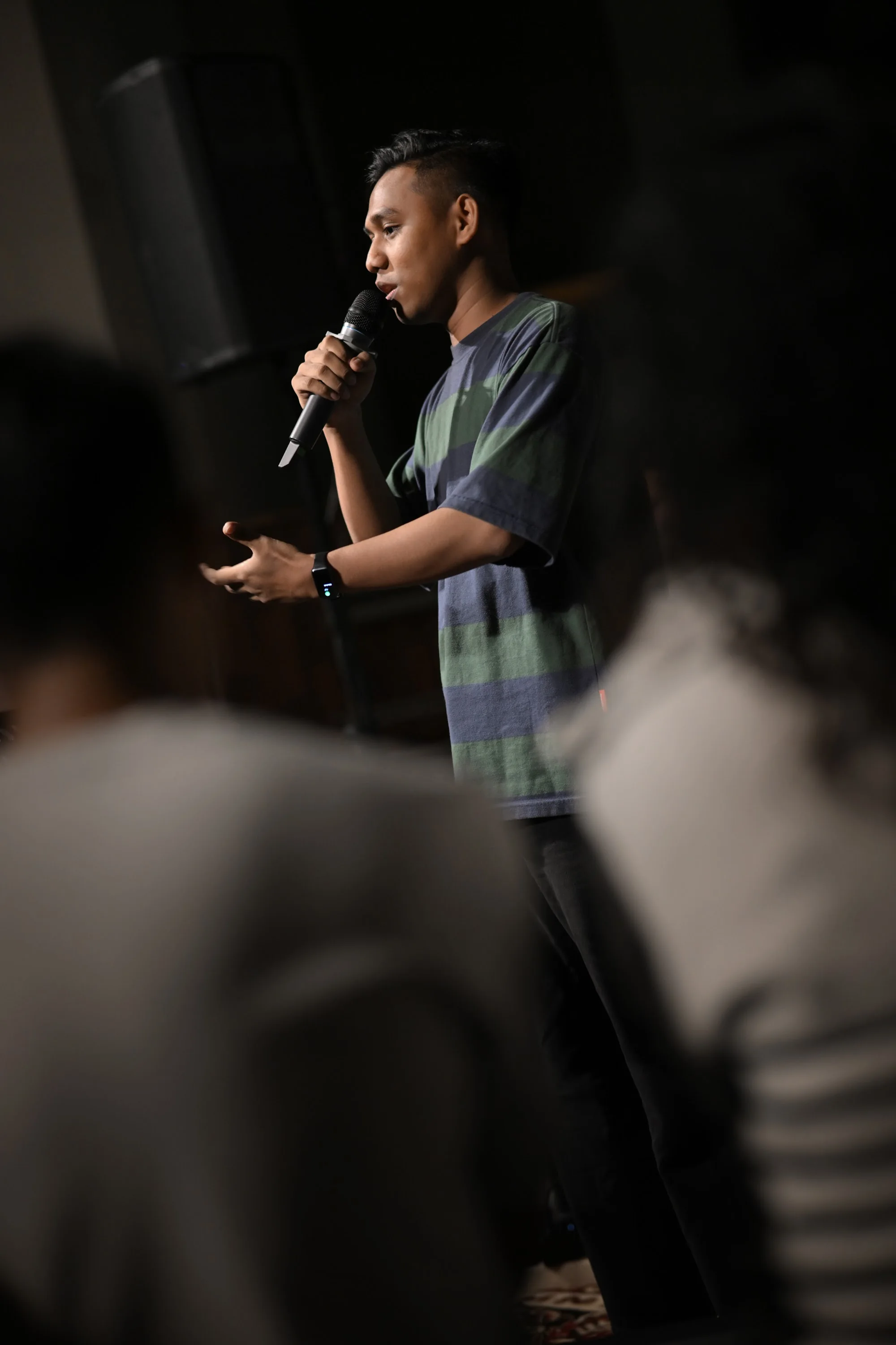 A speaker addresses the gathered City Soul Vol. 3 community with a microphone